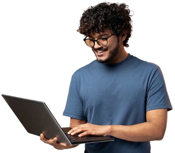 Student holding laptop smiling